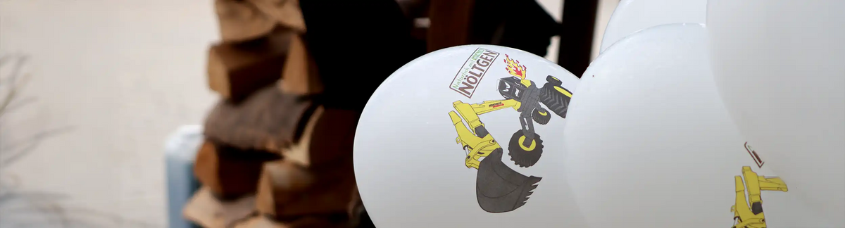 Ballon mit Menzi Muck Aufdruck und Nöltgen Logo – Banner zur Kategorie Events & Termine